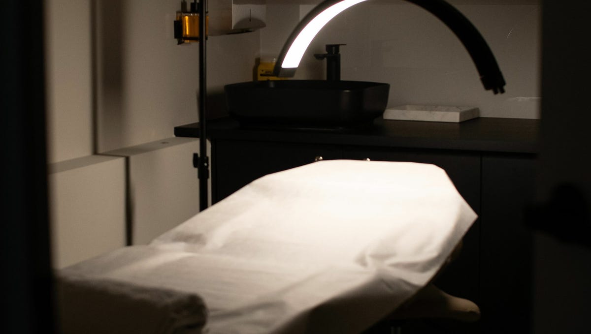 Treatment bed with ring light in the studio
