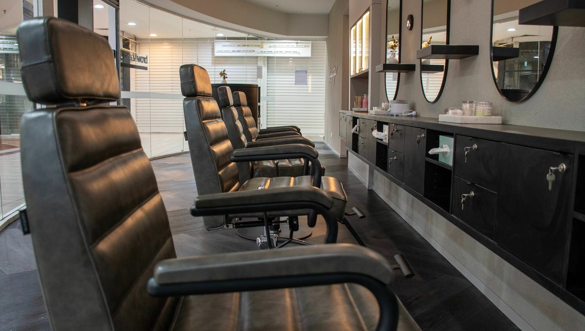A row of treatment chairs inside the studio